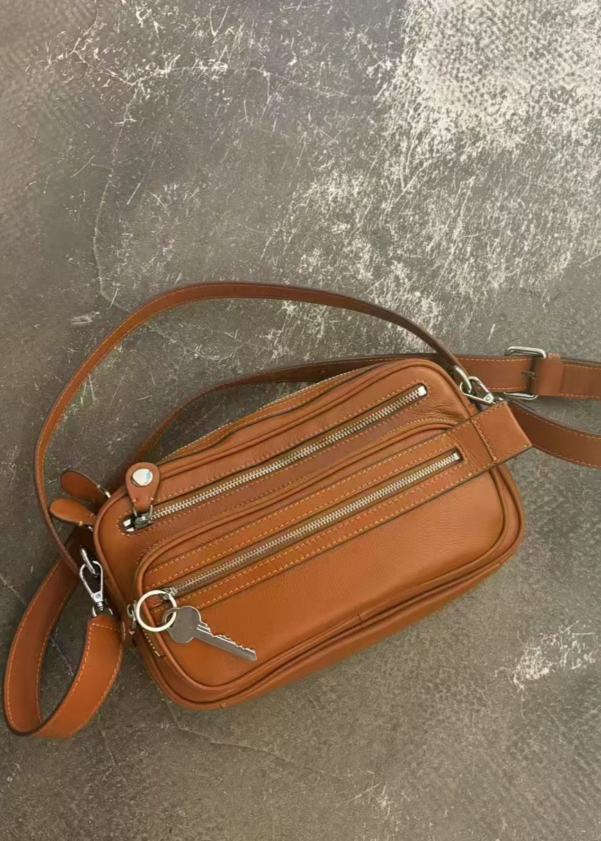 Black Vegan Leather Crescent Crossbody Bag – Adjustable Strap, Multiple Zipper Pockets, Sleek Silver Accents
