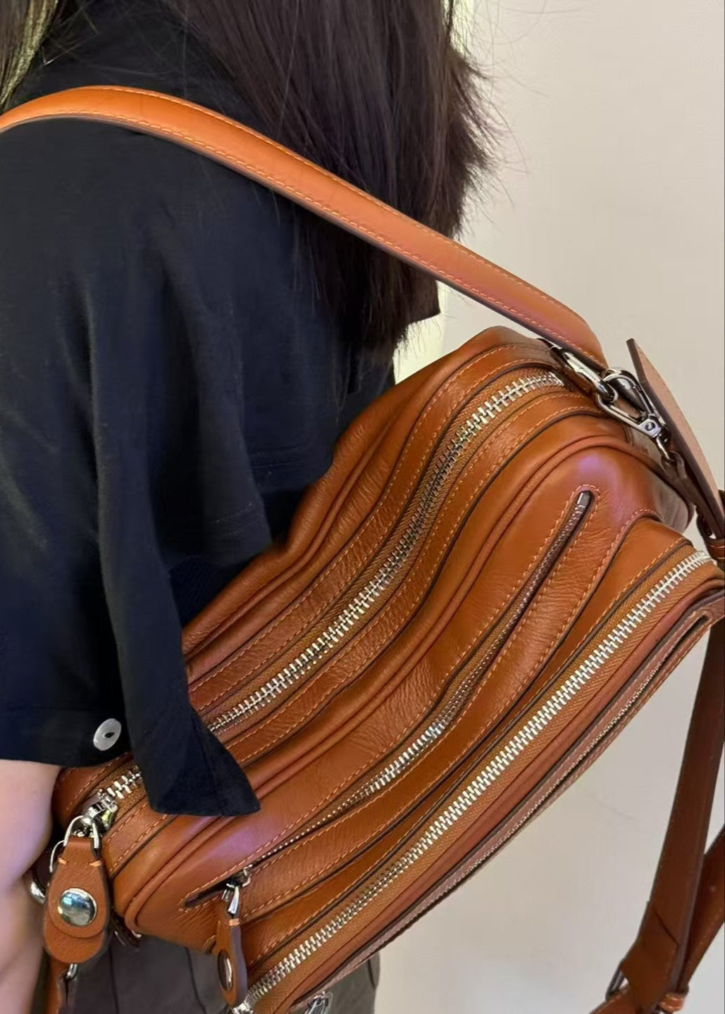 Black Vegan Leather Crescent Crossbody Bag – Adjustable Strap, Multiple Zipper Pockets, Sleek Silver Accents