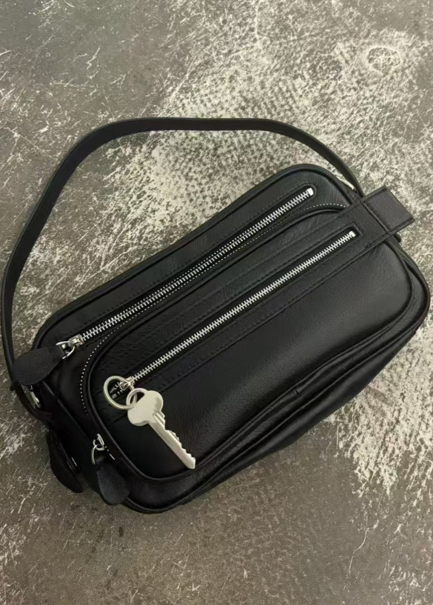Black Vegan Leather Crescent Crossbody Bag – Adjustable Strap, Multiple Zipper Pockets, Sleek Silver Accents