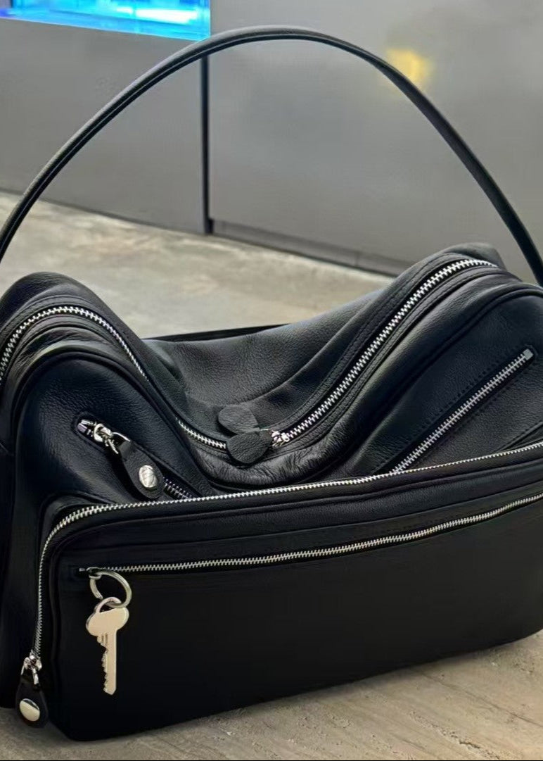 Black Vegan Leather Crescent Crossbody Bag – Adjustable Strap, Multiple Zipper Pockets, Sleek Silver Accents